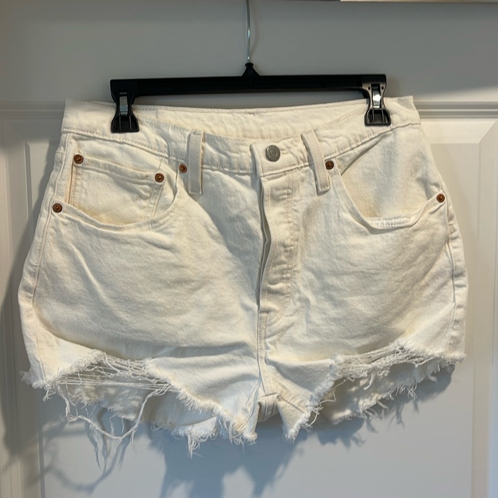 Levi’s 501 white/cream distressed high waisted jean shorts